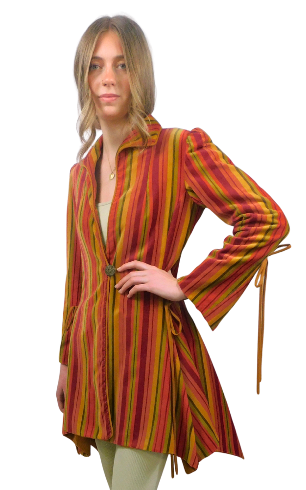 Woman wearing a colorful striped coat with a white background