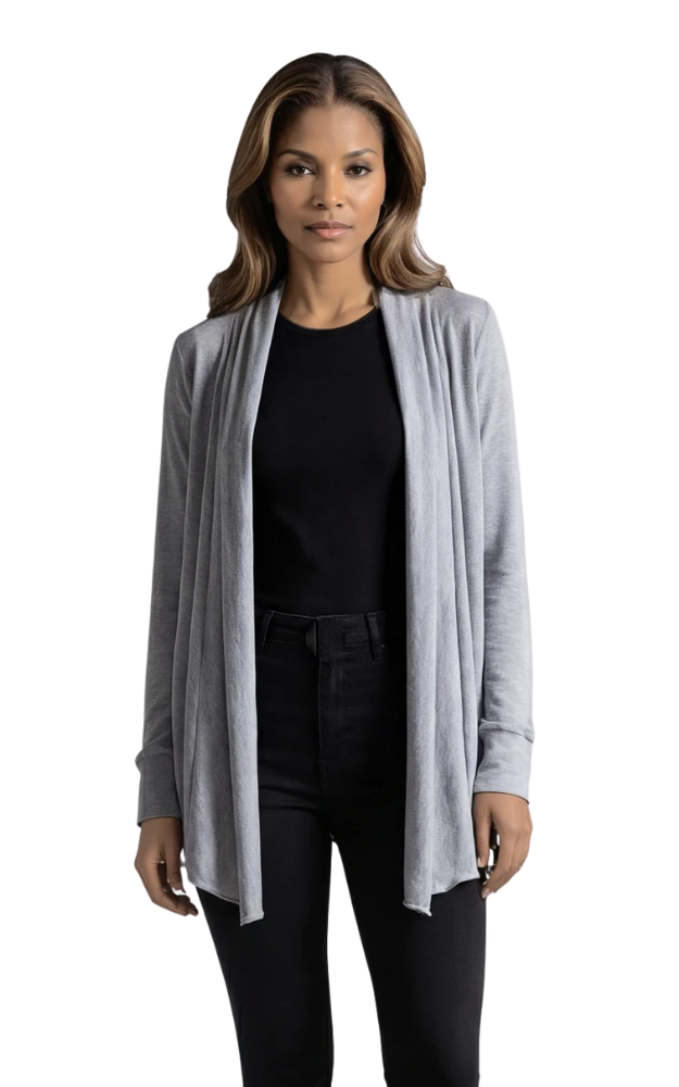 Woman wearing a gray cardigan over a black top on a white background