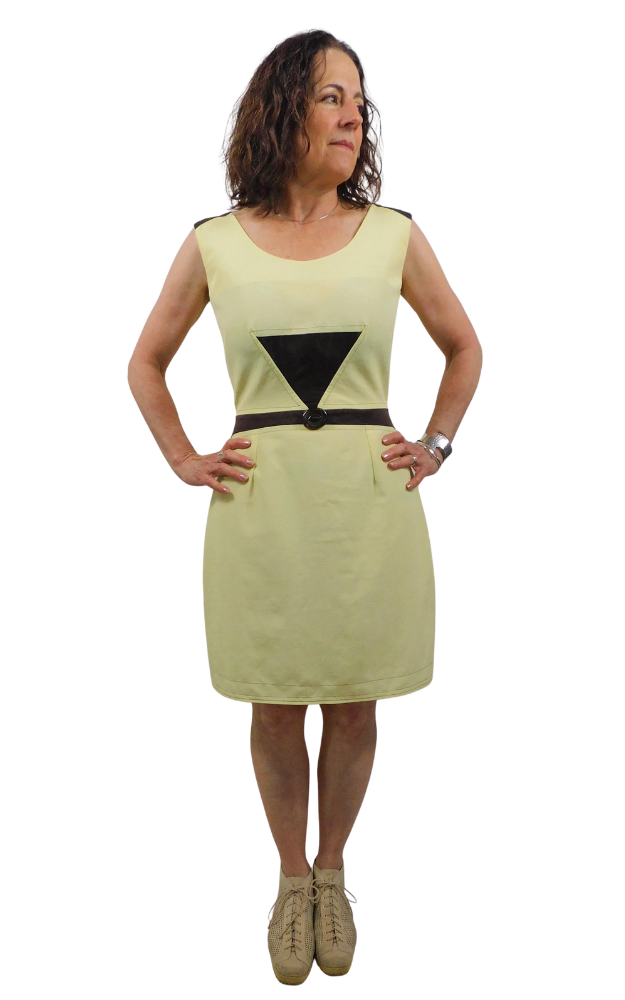 Woman wearing a yellow dress with a brown belt and triangle design on a white background